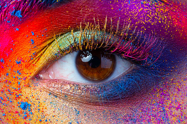 Close up of a colorful human eye.