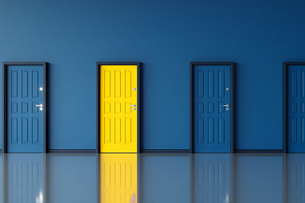 Row of blue doors with one yellow door.