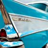 Side view of Chevy BelAir logo on side of teal car